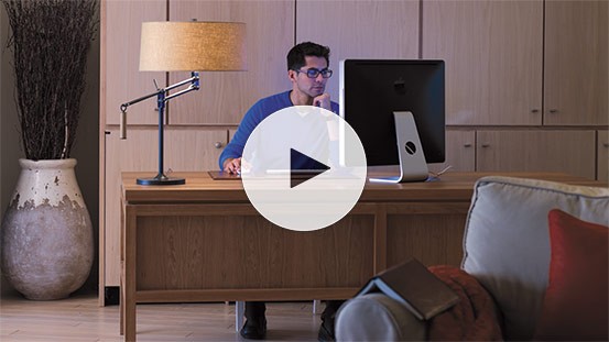 A mid-30s man researches a KOHLER generator online