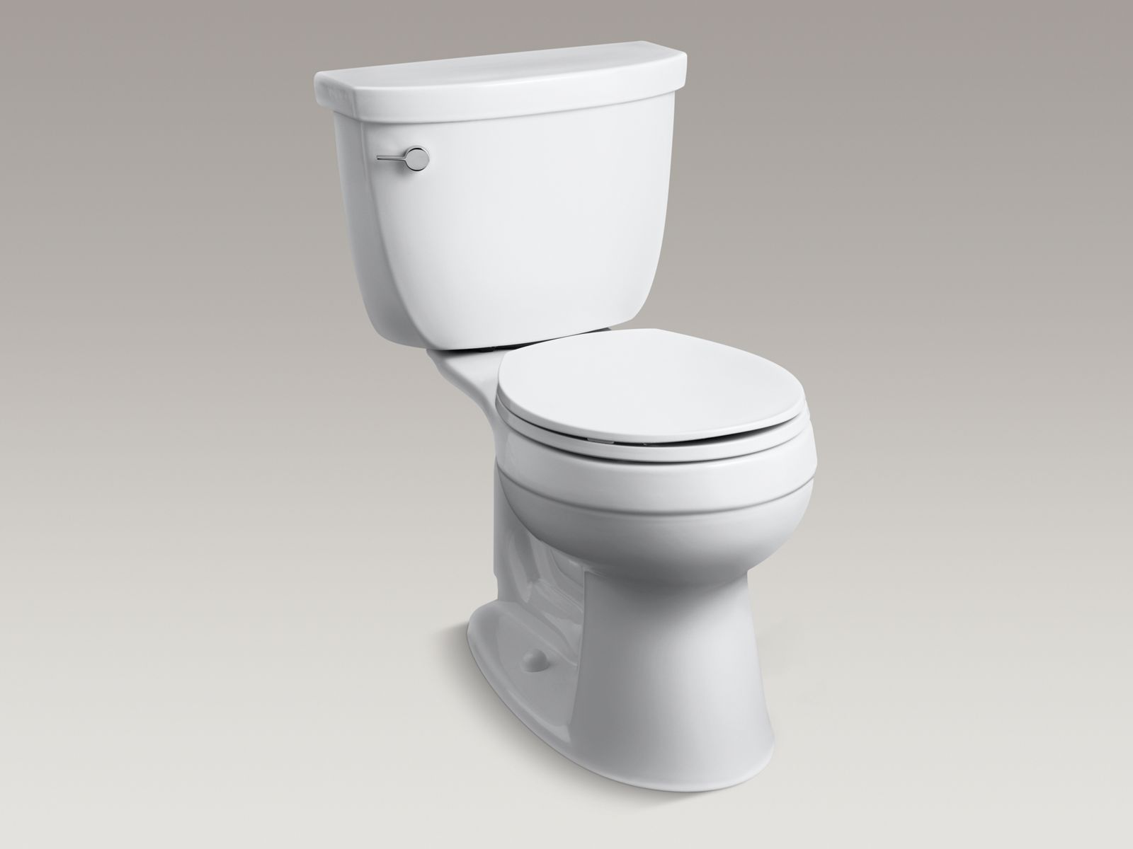 Cimarron® Comfort Height® two-piece round-front 1.28 gpf toilet and left-hand trip lever