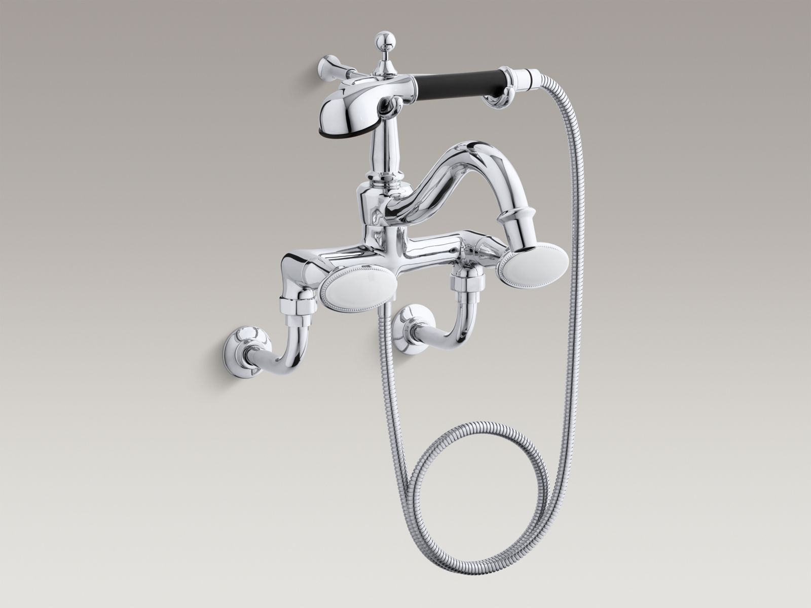Antique floor/wall bath faucet with oval handles and handshower