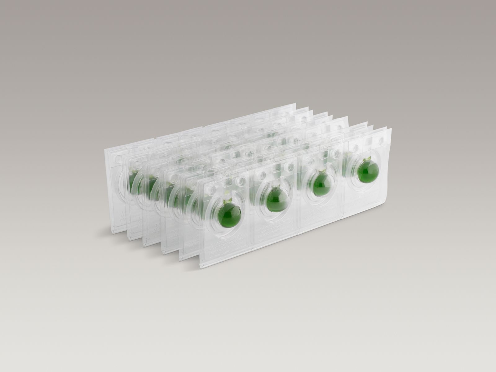 Waterless urinal maintenance balls