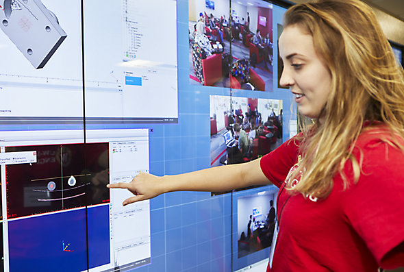 A University of Wisconsin-Madison biomedical engineering student looks at a screen in the Kohler Innovation Visualization Studio