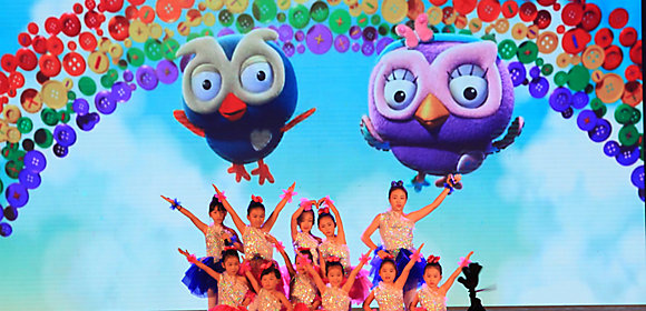 Girls in Zibo, China, wearing dance outfits pose together at a family event