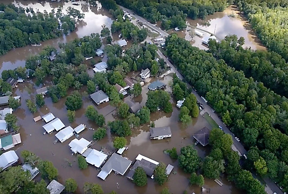 A birds-eye view shows the flooding among houses in Louisiana after 32 inches of rain hit in 34 hours