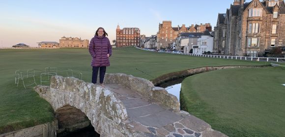Amy Mitchell, IT Systems Project Manager for Kohler Co. in Kohler, Wisconsin, stands on a stone bridge in Europe