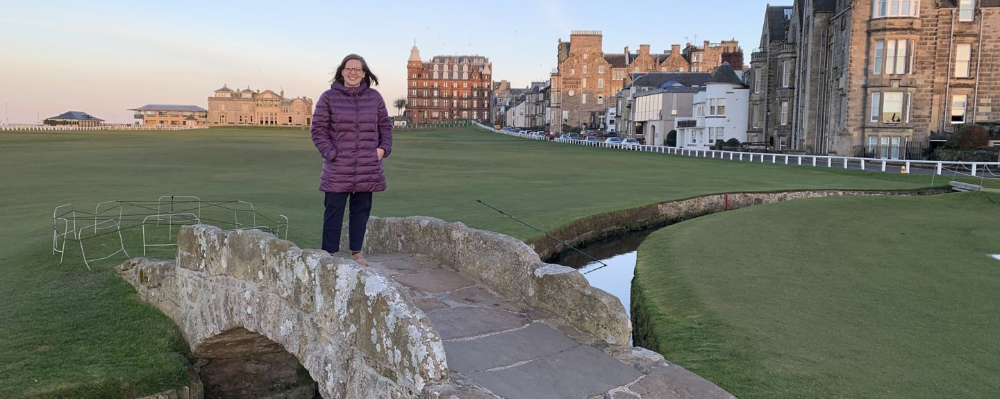 Amy Mitchell, IT Systems Project Manager for Kohler Co. in Kohler, Wisconsin, stands on a stone bridge in Europe
