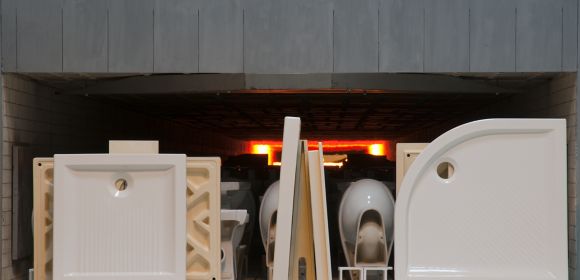 A photo taken from outside shows KOHLER shower bases and baths about to be fired in a giant kiln