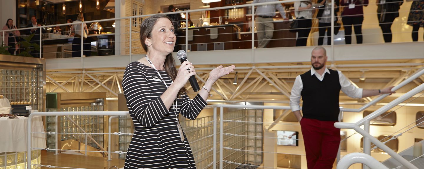 Stacy Redding stands in the middle of the Kohler Design Center.
