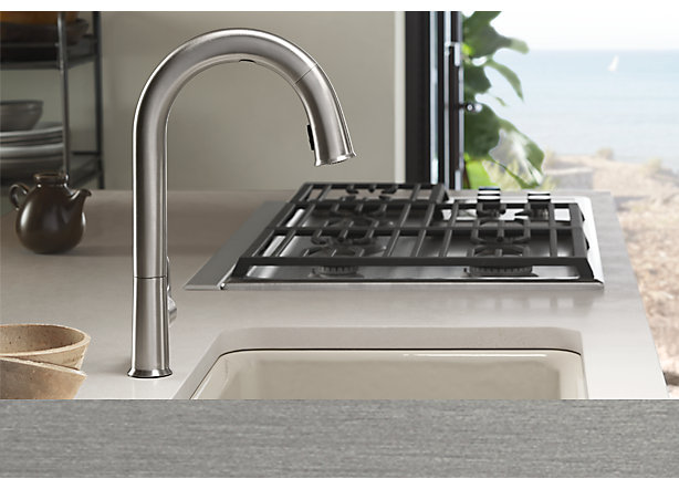 Kitchen faucet in brushed stainless finishing on kitchen countertop