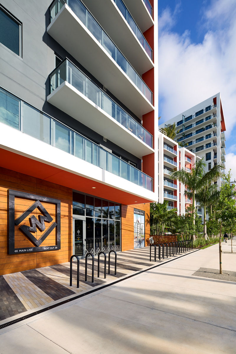 Image of the main entrance to the Midtown Miami building in daylight.