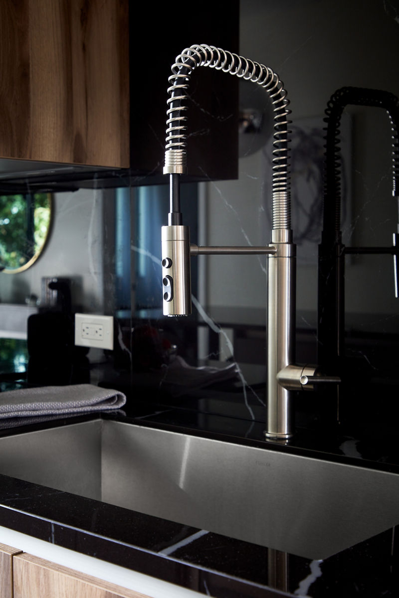 Closeup of semi-professional kitchen faucet.