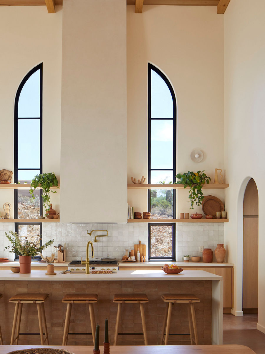 <p>Intentional and minimal decorating creates a timeless look in the New Darlings’ vaulted ceiling kitchen, featuring a <a href="/content/kohler/us/en/products/kitchen-faucets/shop-kitchen-faucets/graze-wall-mount-pot-filler-22066.html?skuId=22066-2MB">Graze<sup>®</sup> wall-mount pot filler faucet</a> and <a href="/content/kohler/us/en/products/kitchen-faucets/shop-kitchen-faucets/crue-touchless-pull-down-kitchen-sink-faucet-w-three-function-sprayhead-22974.html?skuId=22974-2MB">Crue<sup>®</sup> touchless voice-activated kitchen sink faucet</a> both in Vibrant<sup>®</sup> Brushed Moderne Brass.</p>