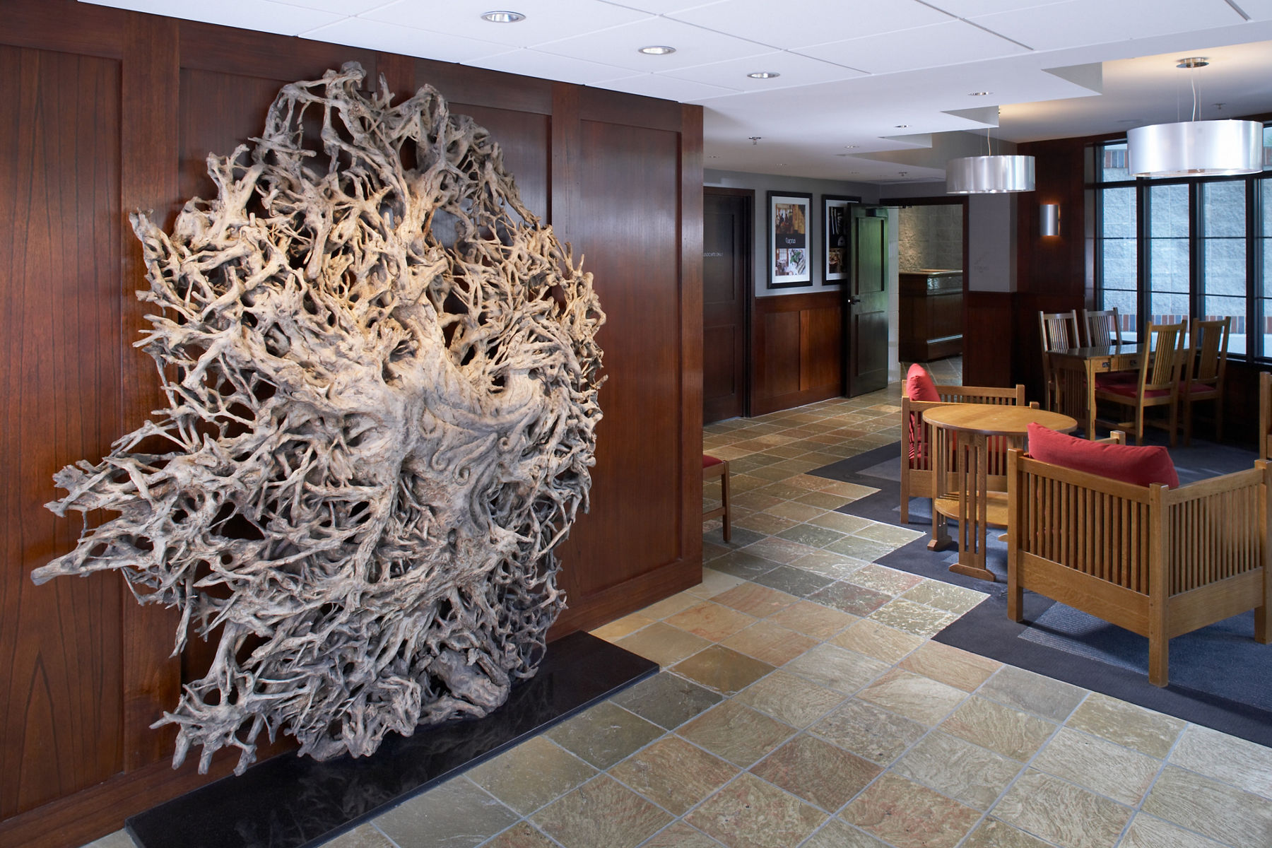 View of empty lobby at Inn on Woodlake with closeup of abstract wall decor.