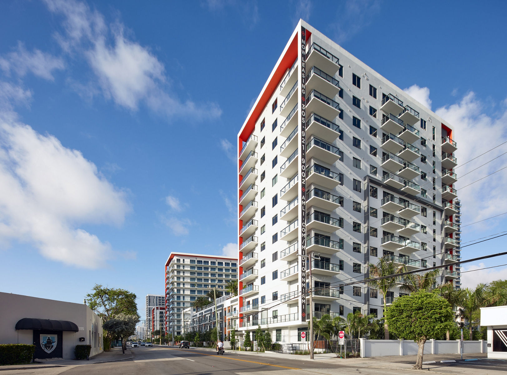 Photo of street view of the Midtown Miami building in daylight.