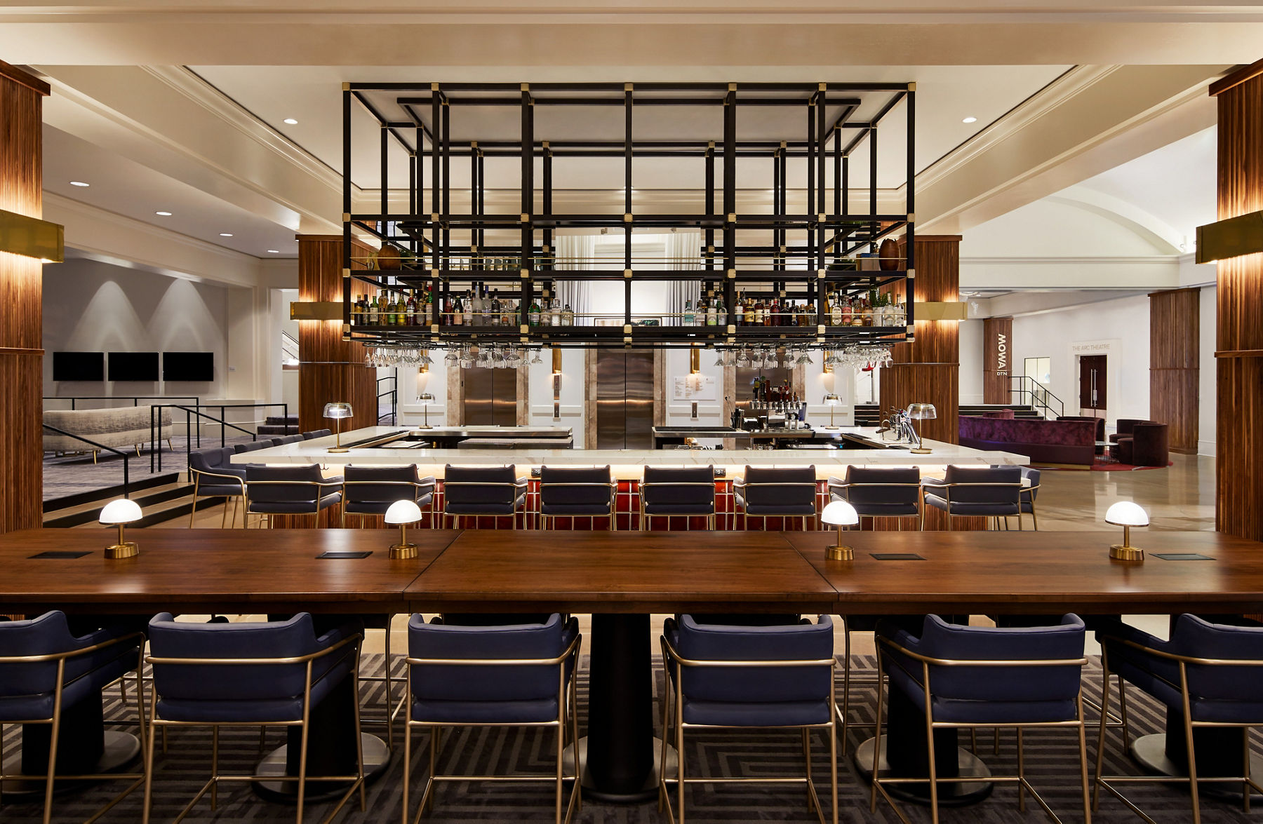 Image of the Bar at Saint Kate hotel featuring a large range of seating and Kohler products with original tiles from Ann Sacks.