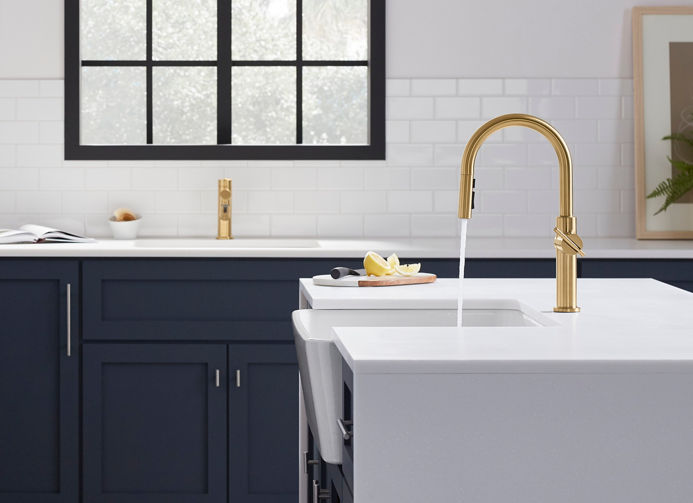 A contemporary kitchen with a vibrant brushed modern bronze Crue collection pull-down kitchen sink faucet.