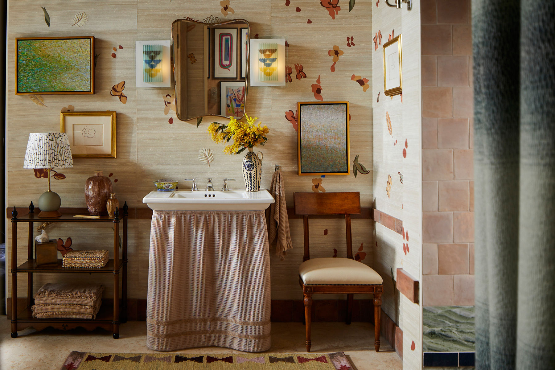 A bathroom by Jessica Jubelirer in the decorative arts style with a freestanding bath in the center.