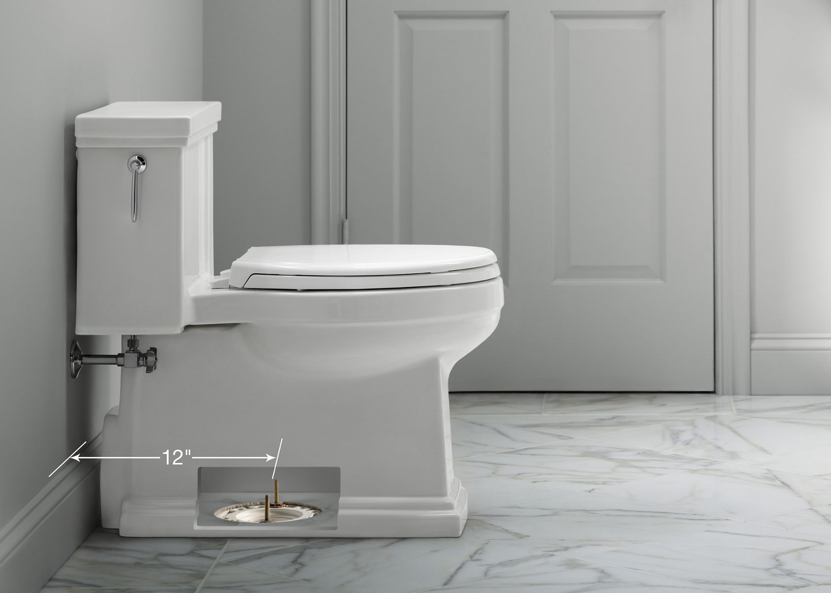 A white KOHLER Tresham Comfort Height one-piece compact elongated toilet seen in profile.