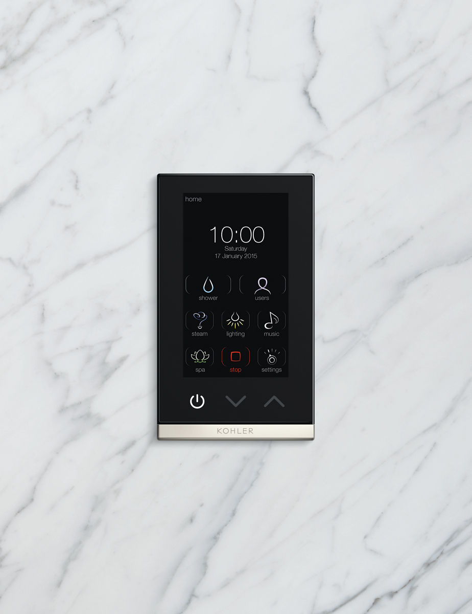 A close-up portrait shot of a digital control pad against a marble background. The screen displays the time and illustrated shower functions.