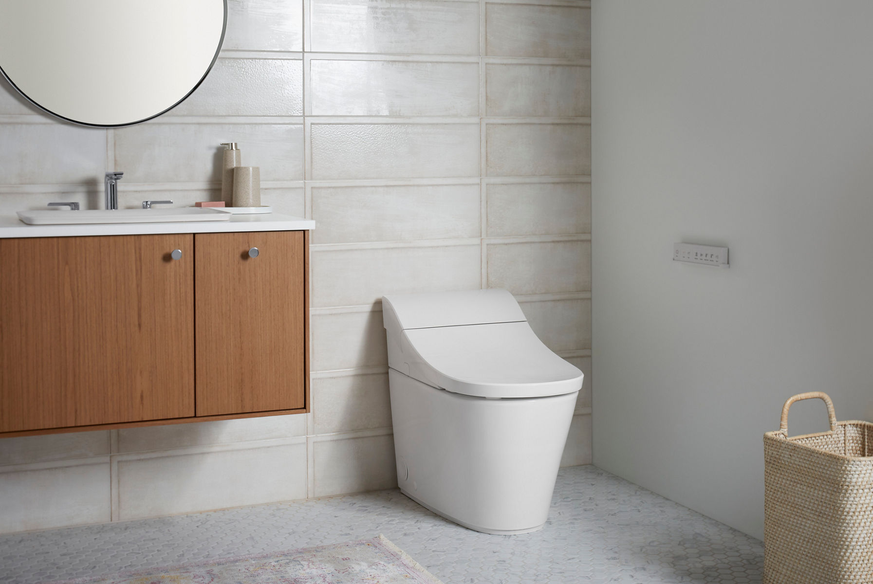Sleek white smart toilet with a smooth, minimalist design, placed against light textured tile walls and modern flooring.