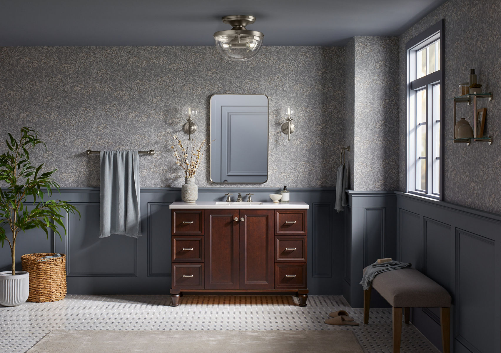 A KOHLER Bellera flush-mount fixture with clear glass domed shade installed on a gray ceiling.