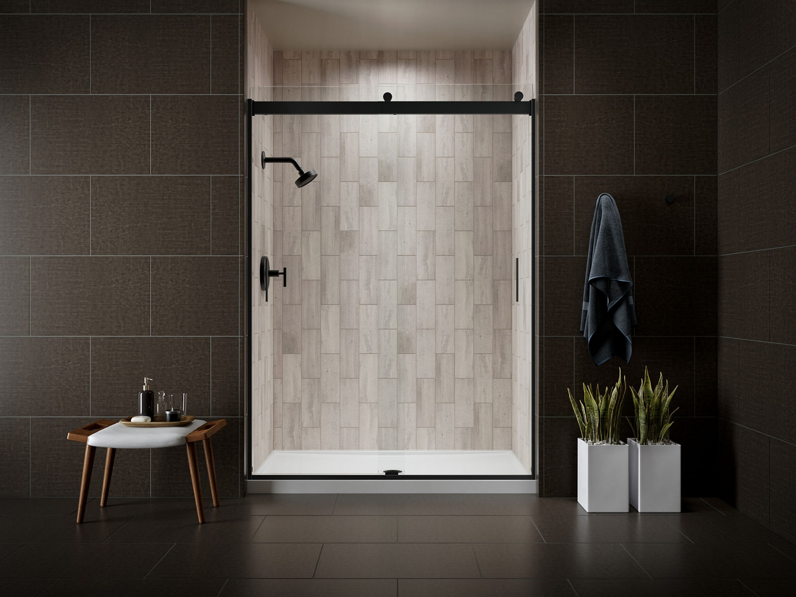 A shower area with sliding shower doors