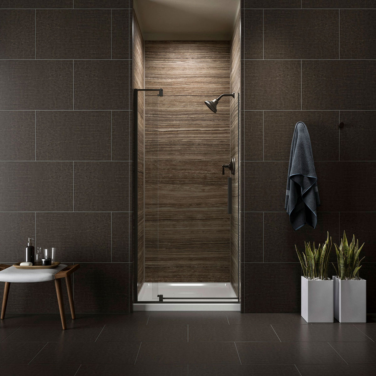 A shower area with a pivoting shower door.