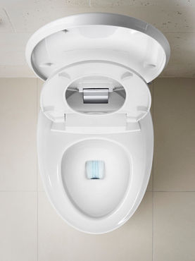 Overhead view of a toilet with the lid and seat raised, showing the way water is propelled at the bottom of the bowl from the flush mechanism.