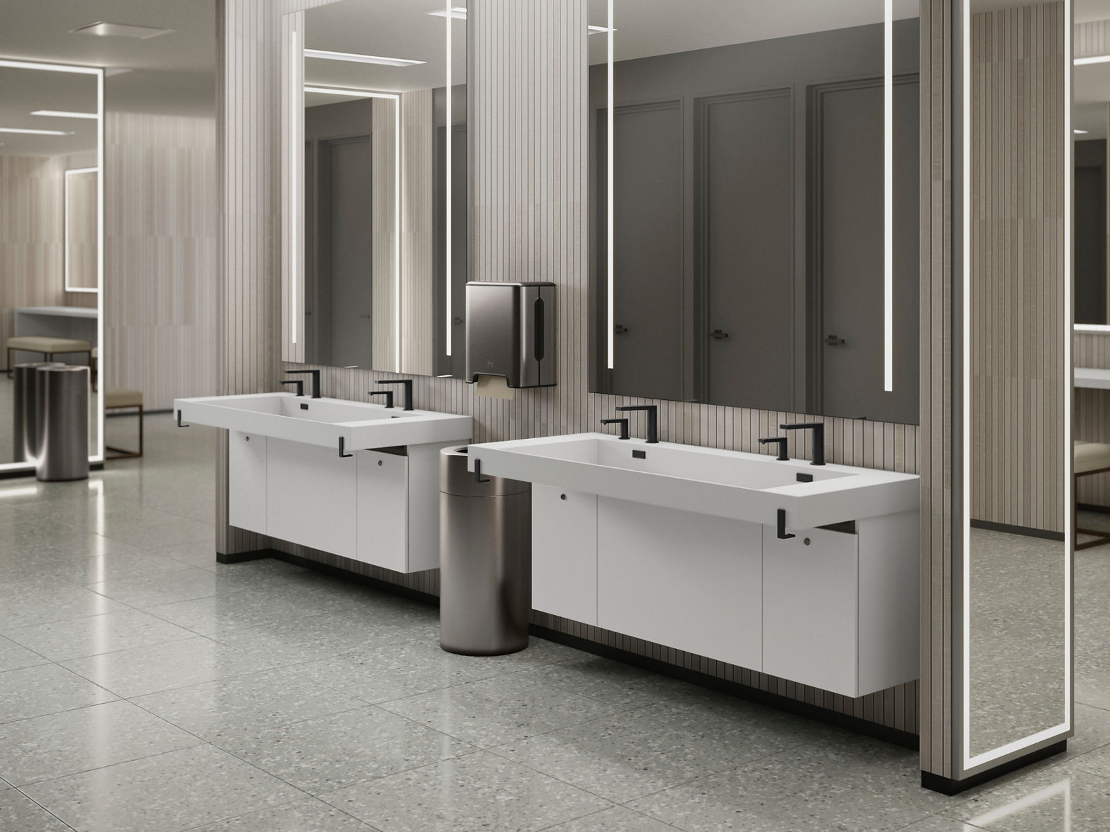 A spacious white commercial sink with multiple stations, designed for easy use in high-traffic restrooms. It features integrated soap dispensers and a streamlined, modern aesthetic.