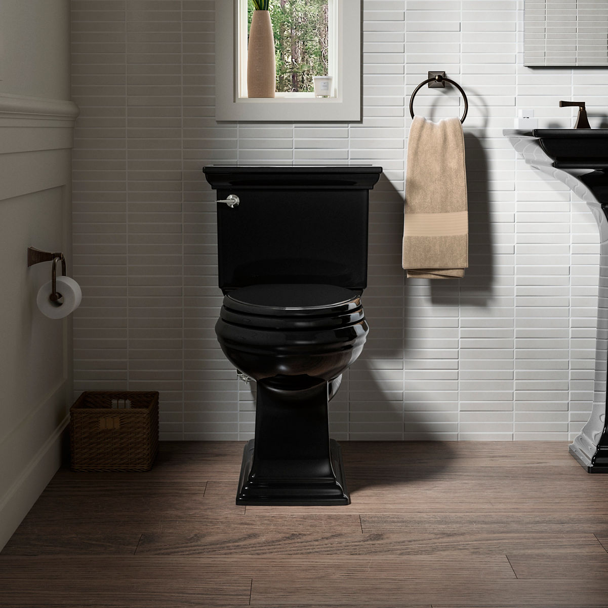 A black toilet on a wood floor with light gray tile.