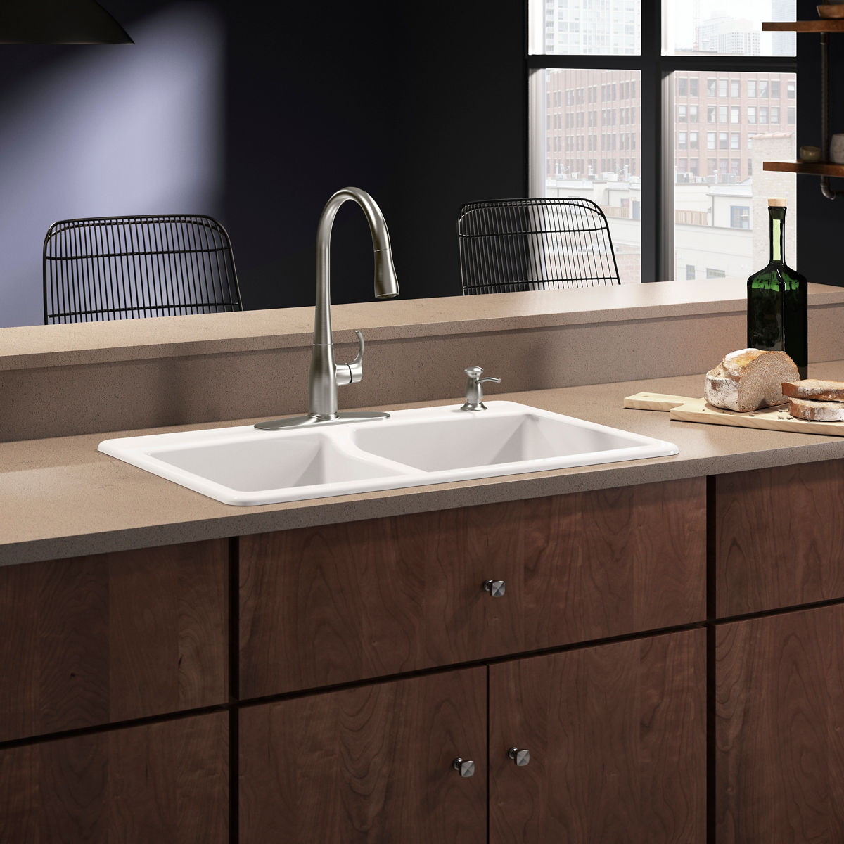 A stainless stee faucet with an escutcheon plate on a white sink with a brown counter top.