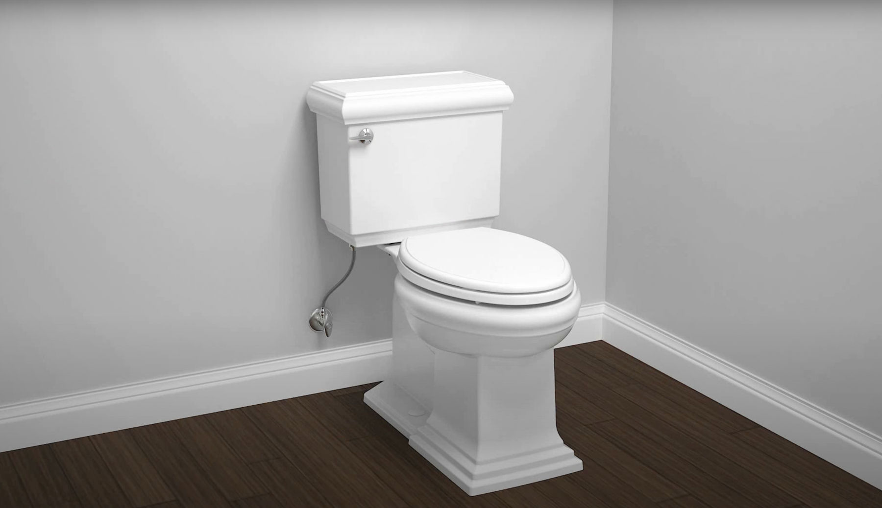A white toilet on a wood floor with light gray walls.