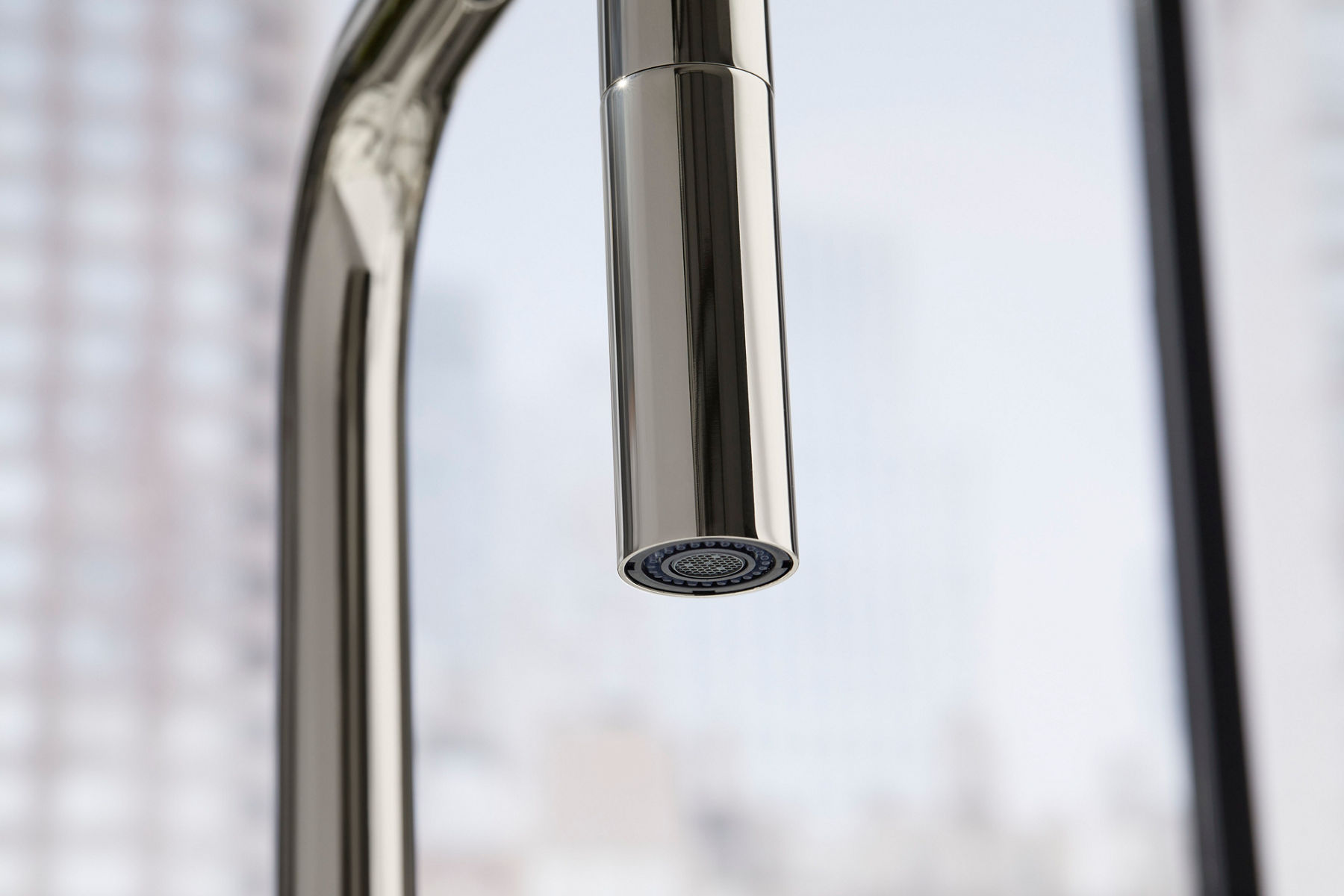 Detail of a faucet spray face.