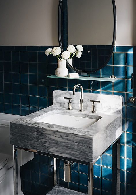 Modern bathroom interior vanity with Ann Sacks wall tile.