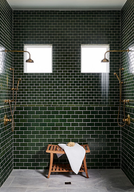 Modern bathroom shower interior with Ann Sacks dark green shower tile.