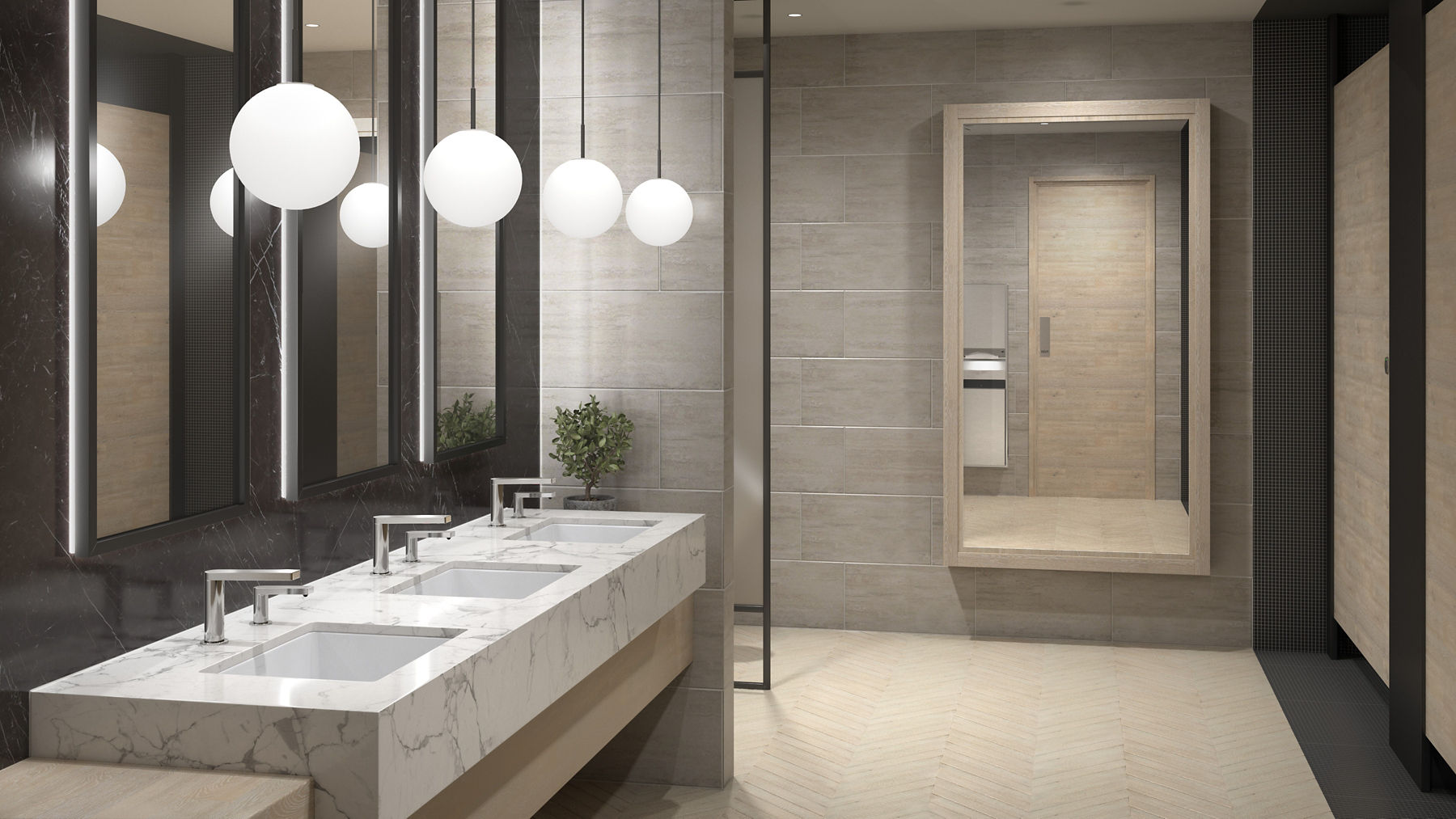 Large public restroom in shades of brown and grey featuring a row of three marbled sinks with Composed touchless faucets and foaming soap dispensers.