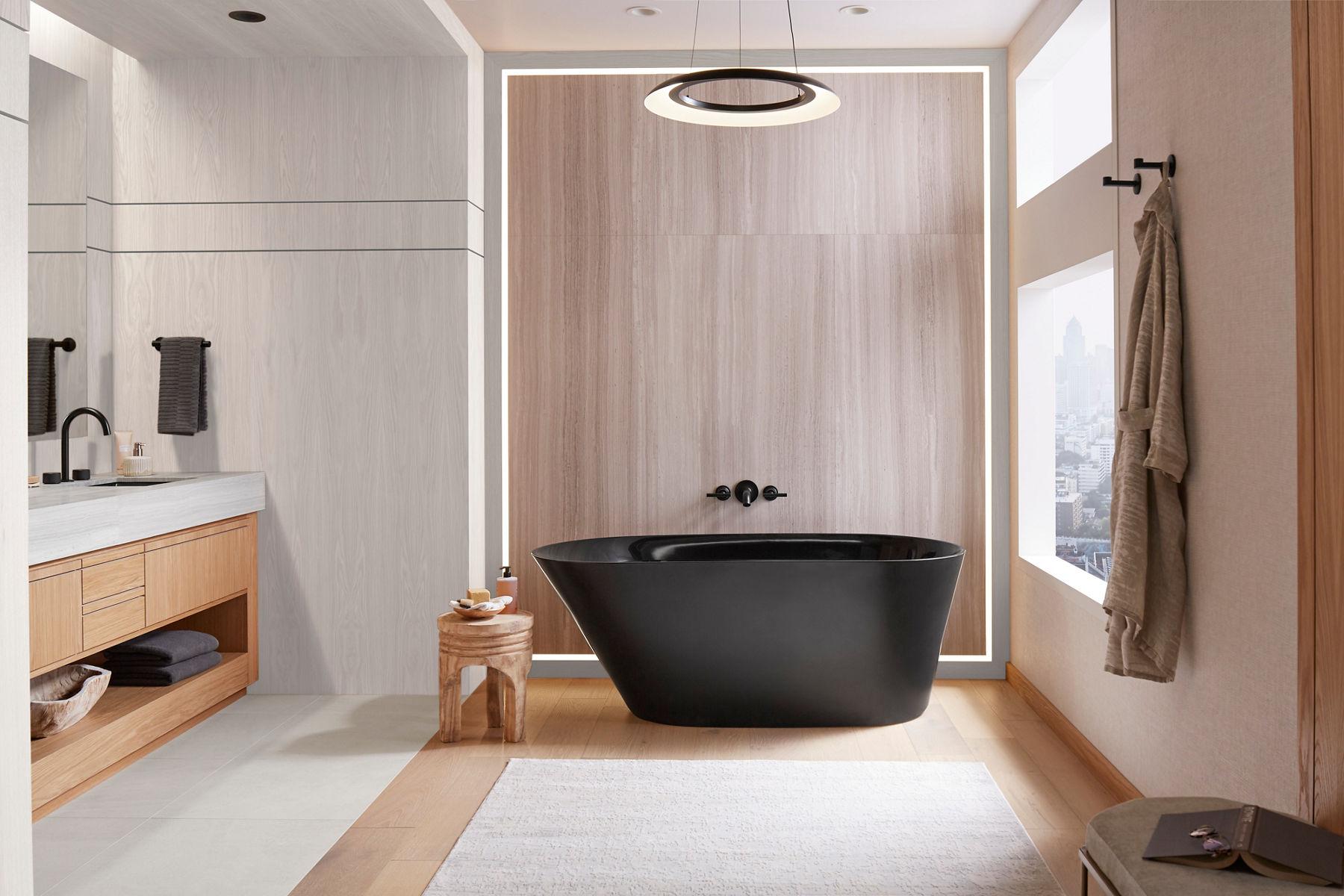 Modern bathroom featuring a sleek black freestanding bathtub with wall-mounted black fixtures, wood accents, and a floor-to-ceiling city view window.