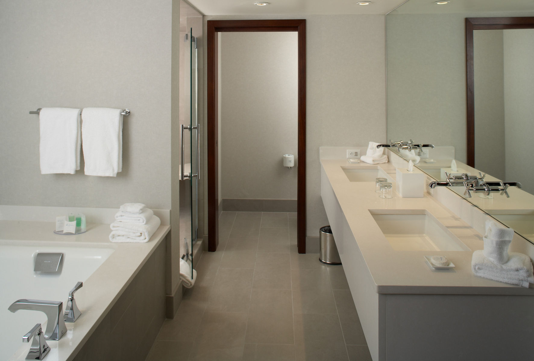 An inside look at the bathroom of a Woodlake Suite Guest Room displaying Kohler products.
