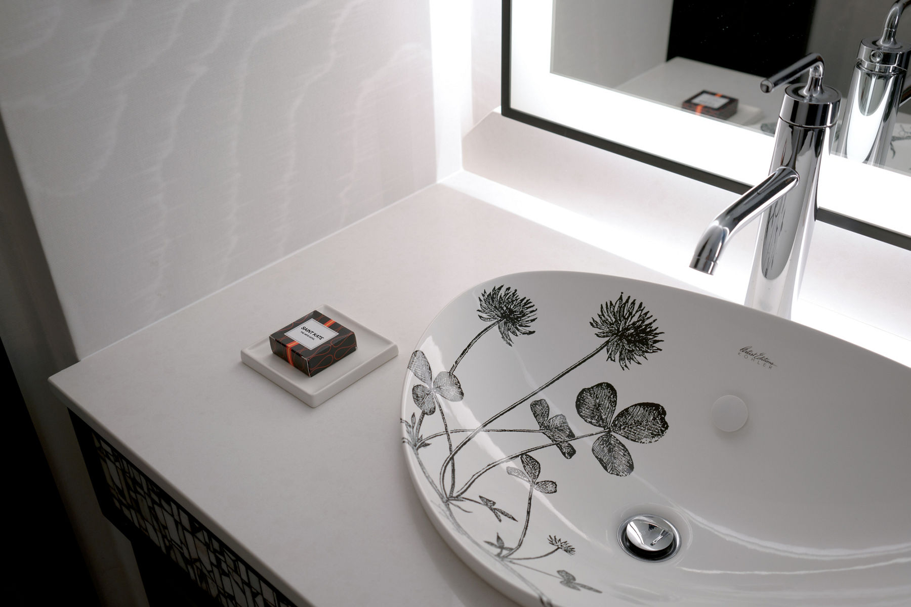 Black and white closeup of  Kohler’s Artist Editions™ sink with floral imagery in its interior.