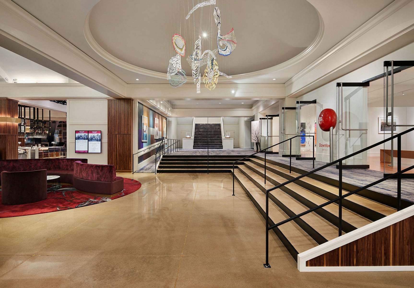 A photo of hotel’s reception lobby showcasing the use of rich materials paired with elegant finishes.