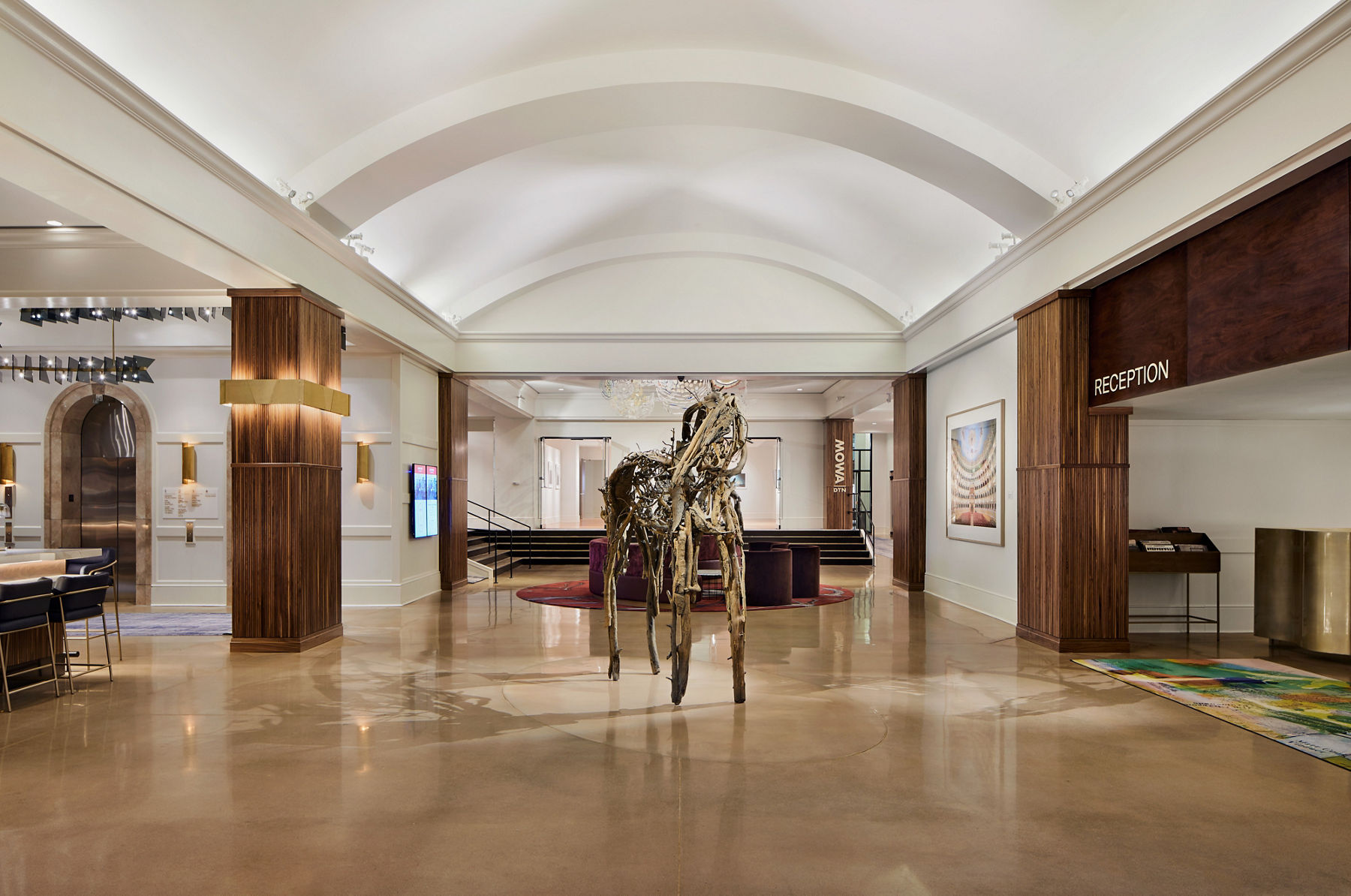A photo of a cast bronze horse sculpture titled “Big Piney” by Deborah Butterfield greets hotel guests and gallery visitors in the reception area.