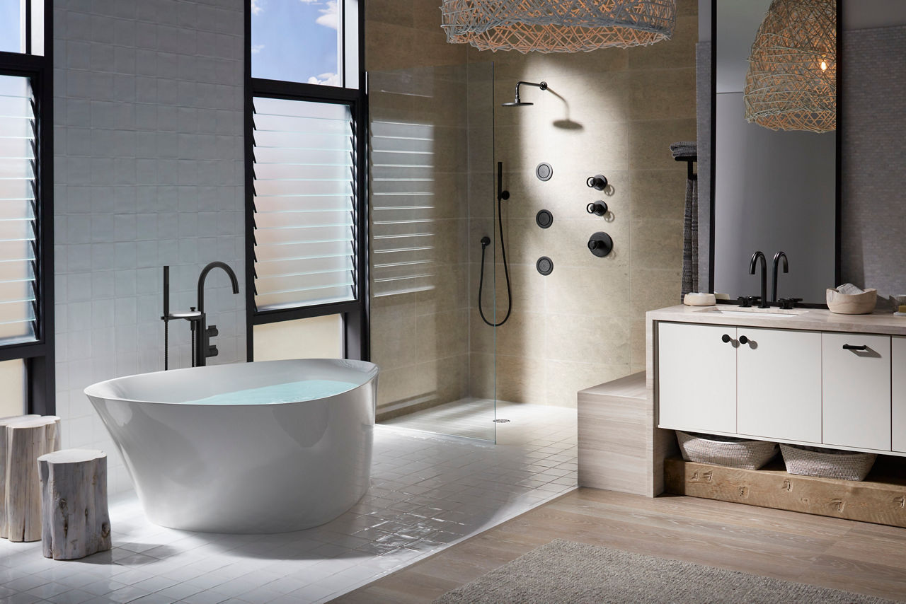 A modern bathroom in tans, off-whites, and dark grays featuring Components collection products.