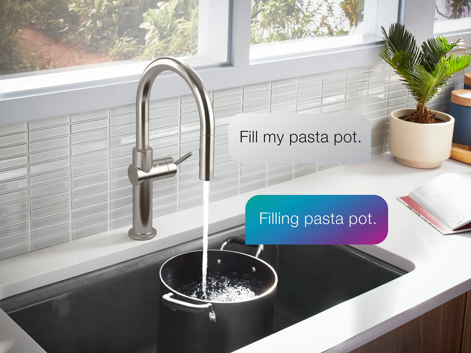 Water flows from a KOHLER voice-activated faucet into a pasta pot sitting in the sink.