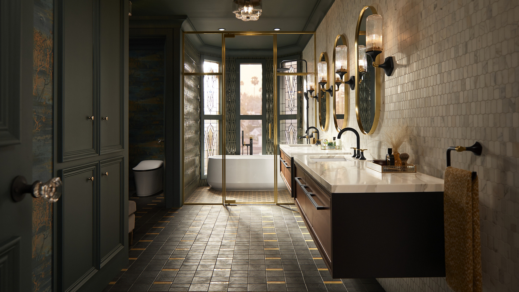 A opulent bathroom in brushed brass, soft greens and matte black with Occasion collection products.