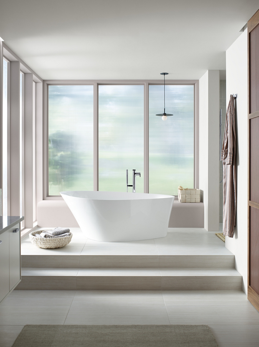 A contemporary bathroom with a white Veil collection freestanding bath and smart toilet.